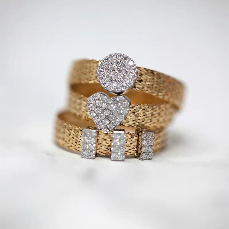 Two diamond-set gold rings stacked together